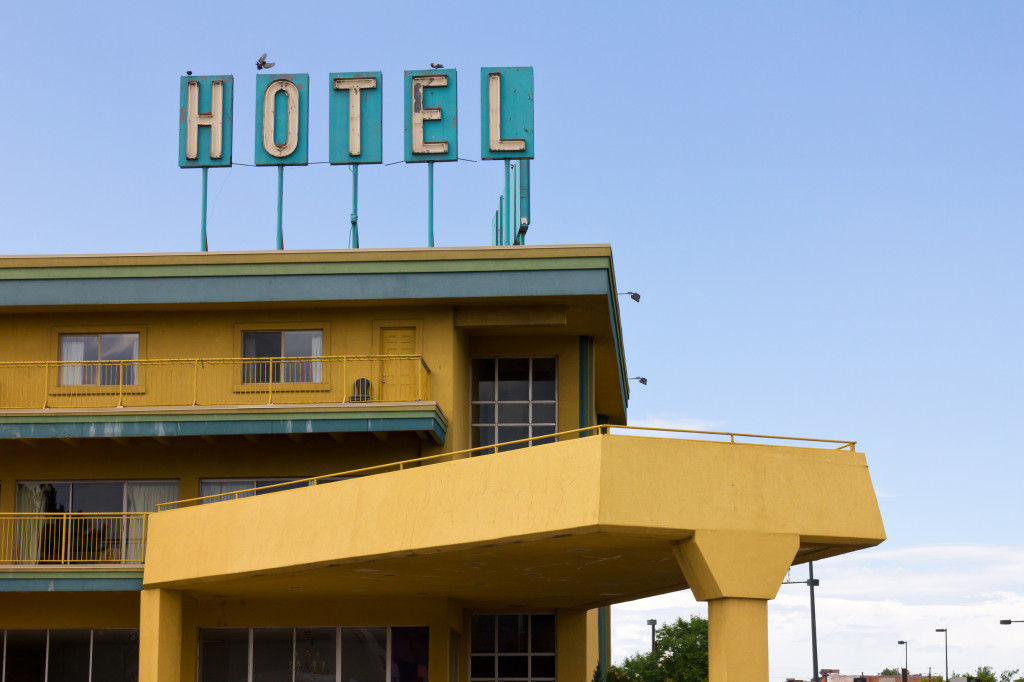 Old Hotel Sign Above Highway Motel